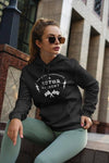 Woman sitting down with sunglasses wearing a Motor Element Vintage Thunder Hoodie